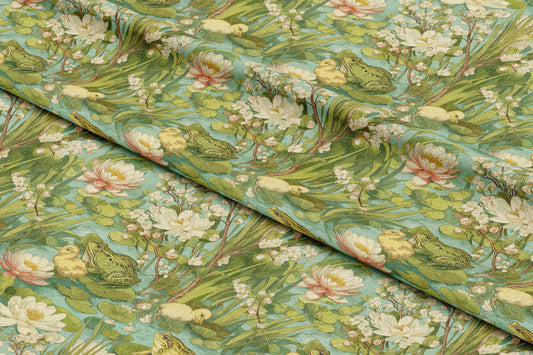 a close up of a green and white flowered fabric