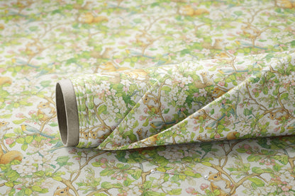 a close up of a floral wallpaper with a roll of tape